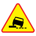 Znak drogowy pionowy A-31 ostrzega o niebezpiecznym poboczu występującym po lewej stronie